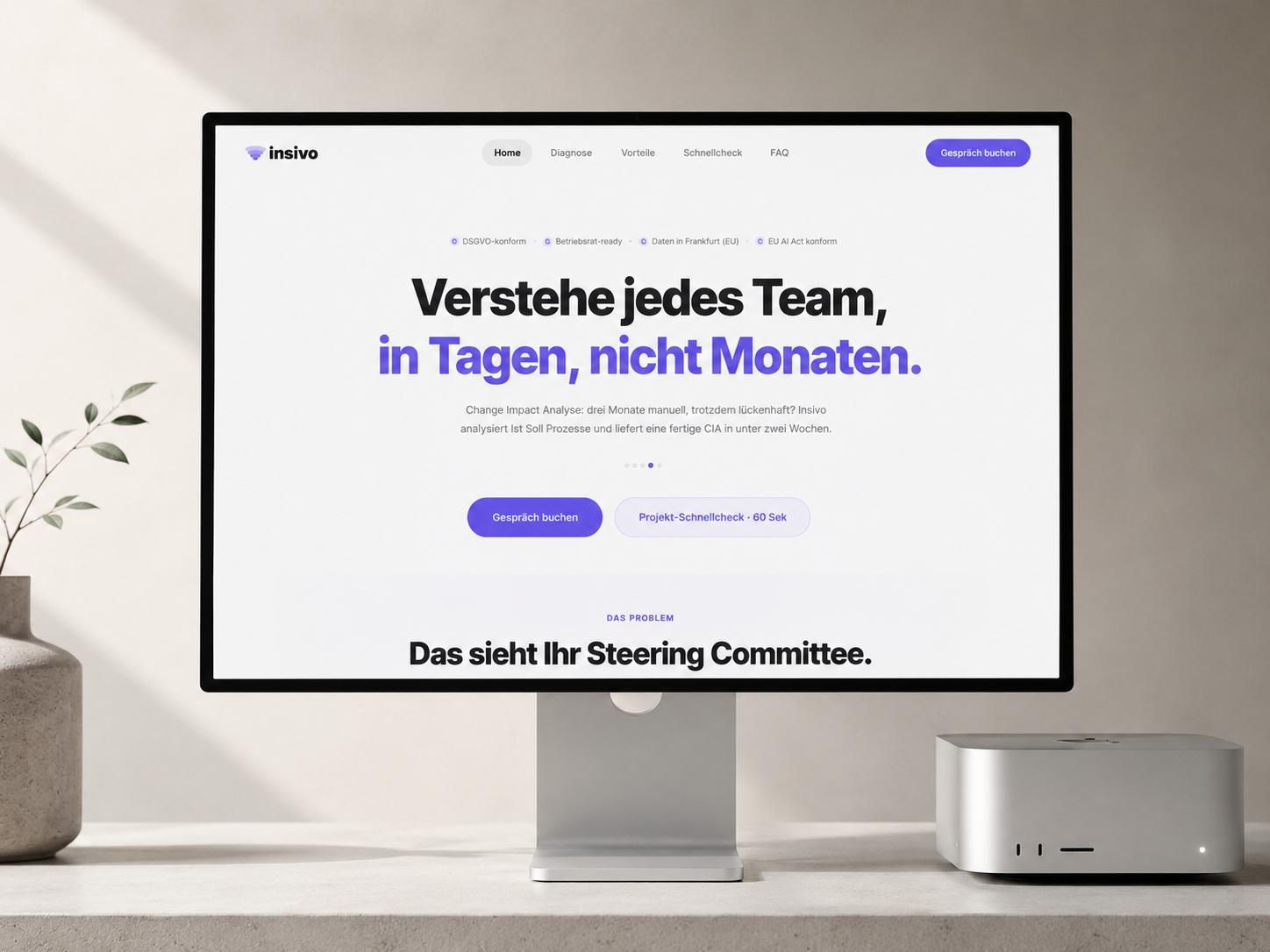 Insivo.ai marketing site on iMac display — calm research-tool aesthetic, indigo accents on cream wall