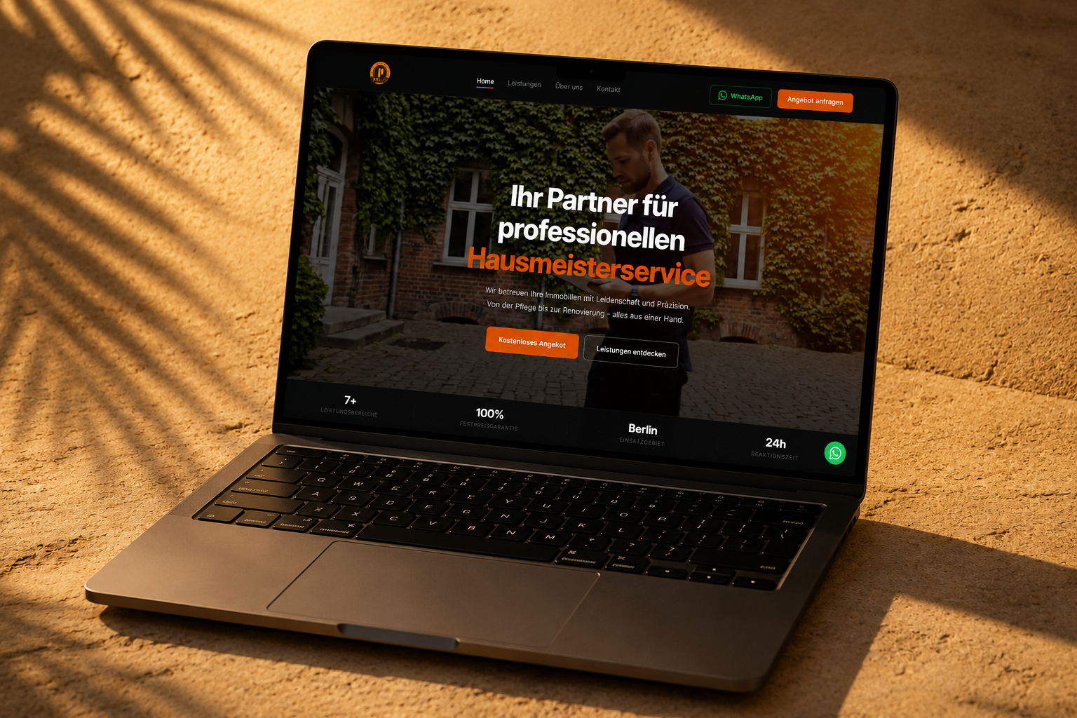 PBA&B website on laptop floating on warm sandstone with palm shadows — atmospheric editorial scene